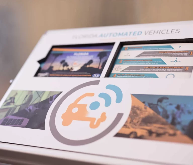 Display signage for Florida Automated Vehicles including small 4x6" informational postcards.